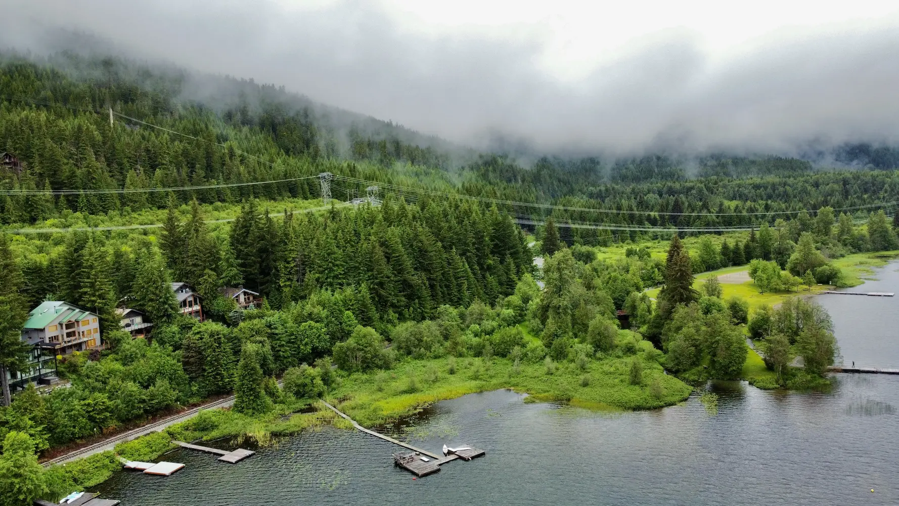 Aerial photo of a shoreline surrounded by fog